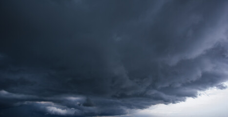 Aufkleber - Bad or moody weather sky and environment. carbon dioxide emissions, greenhouse effect, global warming, climate change. The dark sky with heavy clouds converging and a violent storm before the rain.