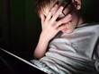 © Nadzeya - Shocked teenager guy watches prohibited content on social networks at night