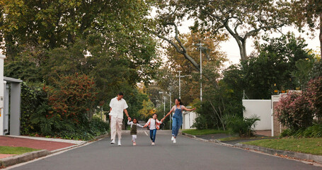 Poster - Family, parents and kids in street, skipping and playful with love, care or holding hands in neighborhood. Happy man, woman and children with funny walk, excited and playing outdoor in road in summer