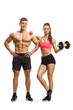 © Ljupco Smokovski - Full length portrait of a fit strong man and woman with a dumbbell isolated on white background