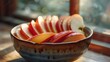 A bowl of sliced apples sitting on a table next to the window, AI