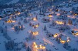Lights illuminate a snowy village at night, creating a beautiful contrast against the darkness