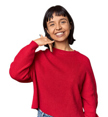 Poster - Young Hispanic woman with short black hair in studio showing a mobile phone call gesture with fingers.