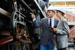 © offsuperphoto - businesspeople checking and pointing to the train on construction site