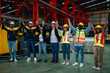 © NewSaetiew - Team engineers and foreman stack hand and shake hands to show success at factory machines. Worker industry join hand for collaboration..