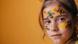 Youthful charm meets creativity in this image of a child with bee and honeycomb patterns painted on their face, a nod to the playful side of nature.