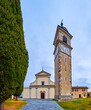 Facade of Sant'Abbondio Chuch with high bell tower, Collina d'Oro, Switzerland