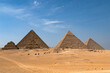 View of the Egyptian pyramids with a caravan in the foreground