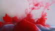 Ink cloud flow. Smoke paint. Bright red blood crimson color water fluid haze wave motion on defocused white abstract art background.