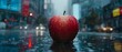   A red apple on a wet street - top, buildings behind