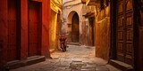 Fototapeta Fototapeta uliczki - Narrow street with red motorbike in the medina of Marrakesh, Morocco.