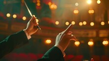 Music Conductors Hands With One Holding A Baton As He Conducts An Orchestra