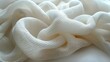 On a white background, we see knitted fabric unraveling