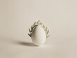 One white egg with a laurel wreath. Symbol of power.