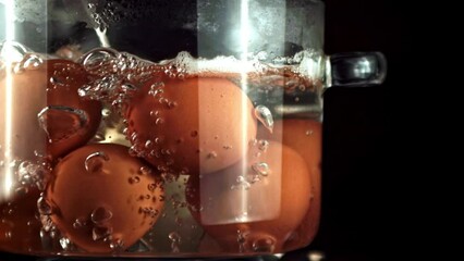 Sticker - Super slow motion eggs boiled in boiling water. High quality FullHD footage