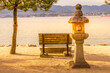 Stone lantern and bench in Miyajima island during a sunset, Japan