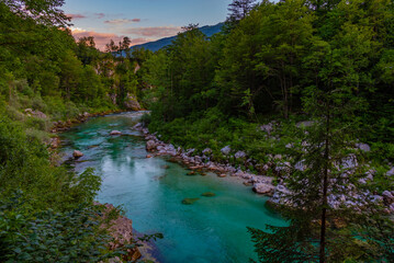 Wall Mural - Sunset view over Soca river in Slovenia