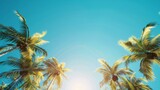 Fototapeta Natura - Low angle view of tropical palm trees over clear blue sky generative ai