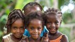 children of dominica, Four smiling children with bright eyes standing together in a natural outdoor setting, representing joy and friendship. 