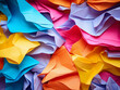 Vibrant backdrop composed of close-up multicolored paper sheets
