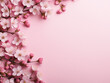 Admire the beauty of flowers showcased from a top view on a pink background