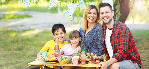 Wall Mural - Happy family having picnic on summer day