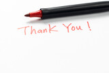 Fototapeta Krajobraz - Hand written thank you message with a red pen on white background, gratitude concept.