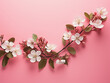 Retro-toned top-down view of blooming apple tree flowers on pink with copy space