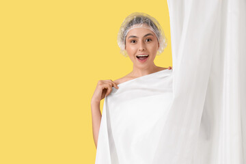 Sticker - Young woman in shower cap with bathroom curtain on yellow background