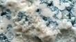 Close-up view of Blue cheese texture, emphasizing its creamy yet crumbly texture and bold, moldy streaks