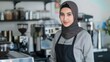 Smiling barista in hijab serving coffee at a modern cafe