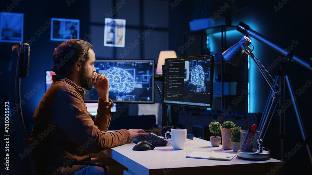 Programmer using computer to update artificial intelligence neural ...