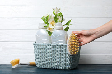 Wall Mural - Detergents in a basket on a white background