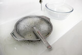 Fototapeta Desenie - Washing dishes with soap