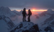 Silhouette of a couple hold hand of each other looking at sunset on top of mountain with background of mountain range and golden color of sunshine
