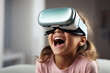 Portrait of happy smiling girl child person wearing virtual reality headset in room.