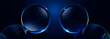 Abstract spheres with symmetrical blue lighting on dark background. Wide wallpaper with copy space.