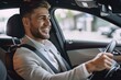 © ttonaorh - Handsome young man is driving a car and smiling driving a car with a clear view of the city through the window. showcasing safe driving with a seatbelt