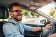 © ttonaorh - Handsome young man is driving a car and smiling driving a car with a clear view of the city through the window. showcasing safe driving with a seatbelt
