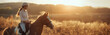 The girl goes in for horse riding. A student sits on a horse against the backdrop of nature and sun rays. Banner with place for text in rustic style