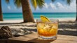 © Konrad - Glass of whisky sour on tropical beach