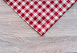 red and white tablecloth on wooden background