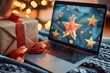 Festive laptop with christmas present and bokeh lights in background