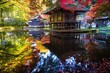 Beautiful shot of wooden huts surrounded by autumn-colored trees reflecting in a lake