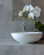 close up of modern sink and faucet with orchid, neutral colors, modern, luxury and minimal
