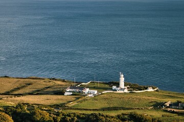 Drone shot of st Catherine's lighthouse on the shore of the sea on the isle of Wight