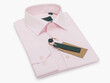 Pink folded men's shirt with long sleeves and buttons on a light background