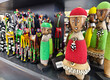 Traditional African wooden hand made dolls and colorful bead decoration at local craft market Nairobi, kenya.