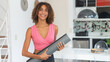 Pretty latin american woman with yoga mat ready for class at gym