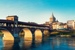Panorama of Ponte Coperto (covered bridge) and Duomo di Pavia (Pavia Cathedral) in Pavia at sunny day, Lombardy, italy.